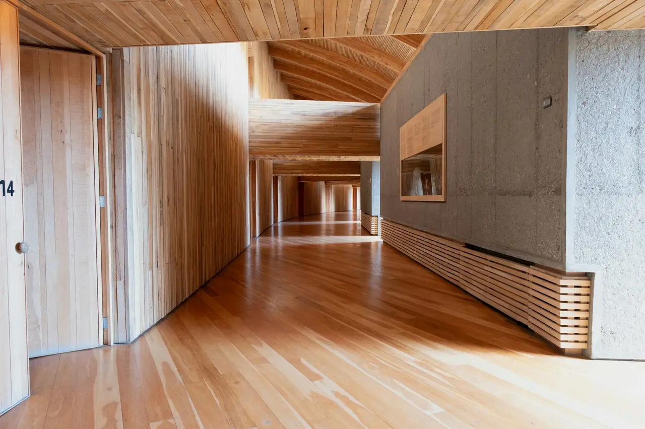 Timber-lined hallway with built-in joinery along one wall
