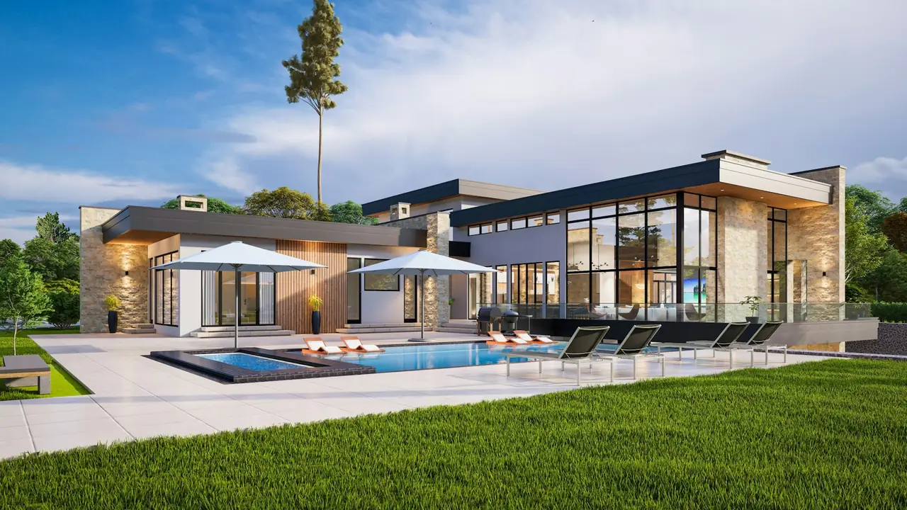 A low modern home with a long pool, umbrellas and lawn
